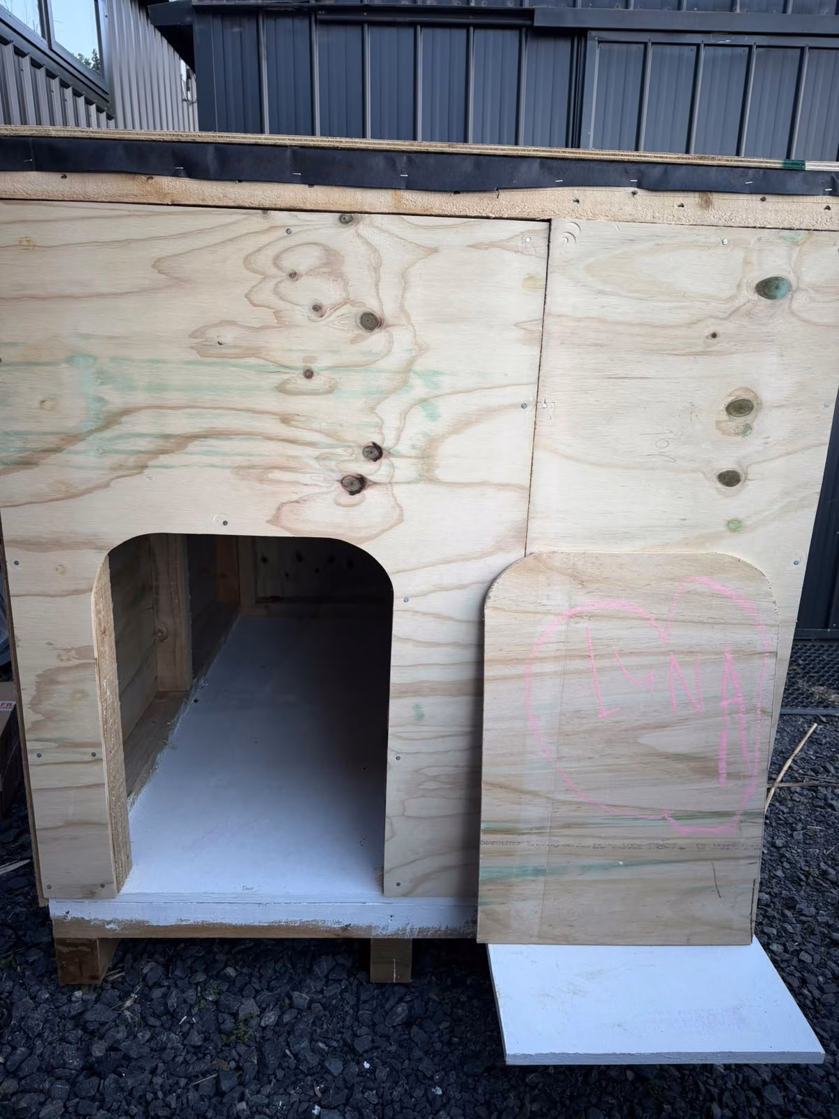 The framed and plywood-lined dog kennel built for Luna at Āhuru Mōwai