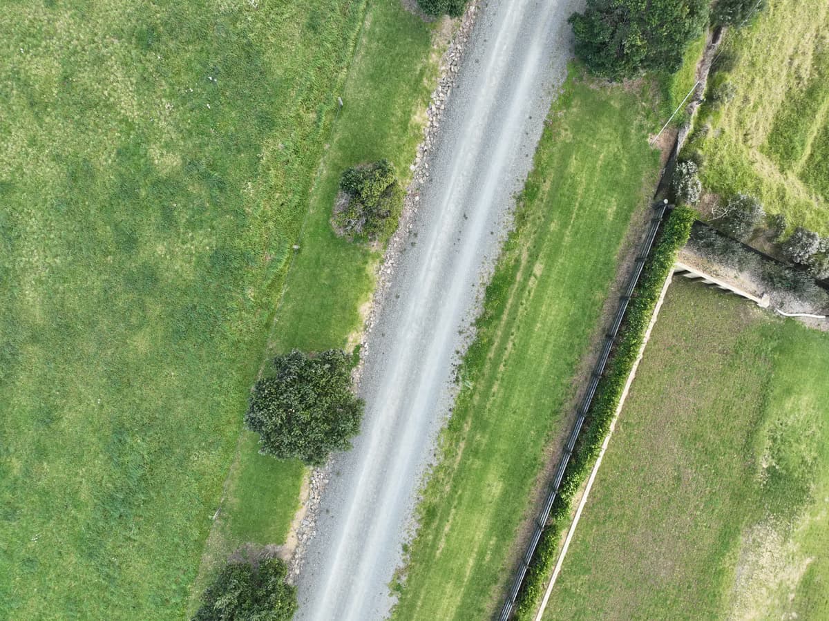 Aerial view along the boundary and gravel road at Āhuru Mōwai